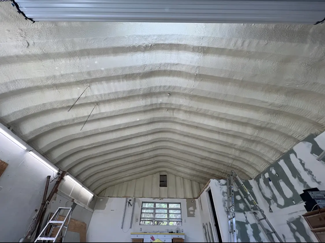 Spray polyurethane foam applied to the underside of a metal roof deck in Jefferson